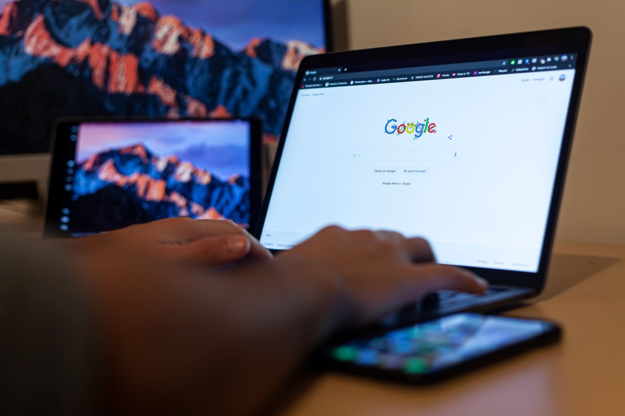 Photograph of a person using a laptop
